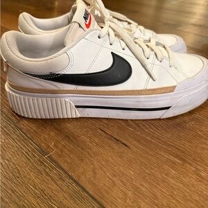 Nike White Sneakers with Black Swoosh and Red Logo